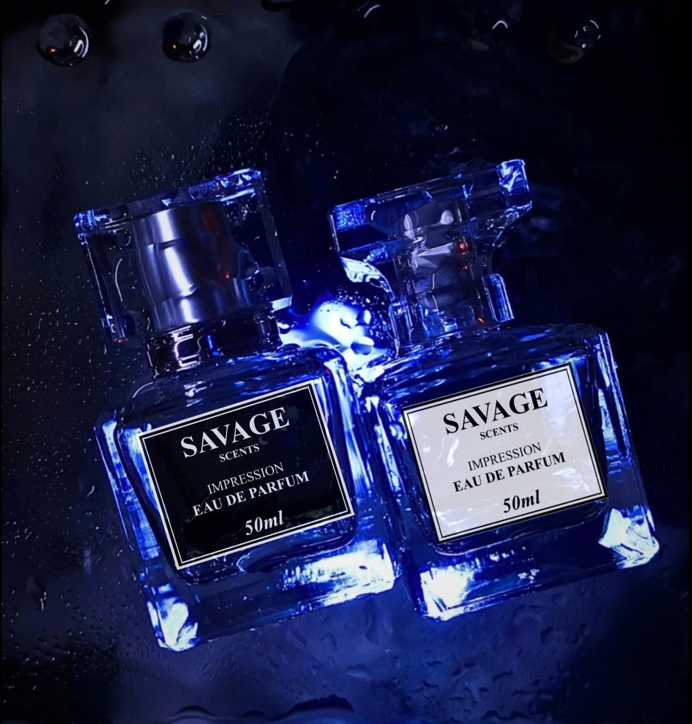 Two bottles of Savage Scents perfume on a dark background