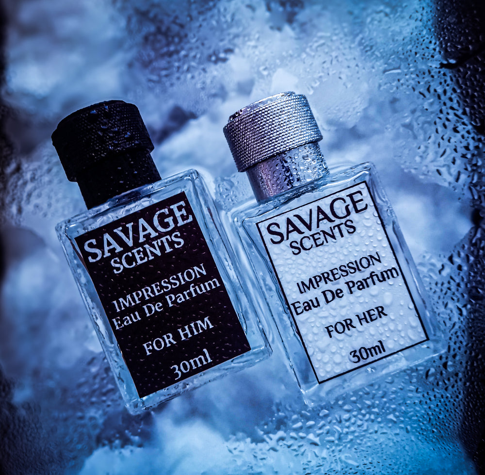 Two bottles of Savage Scents perfume, one for him and one for her, on a textured blue background.
